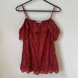 Red top, lace detail off the shoulder